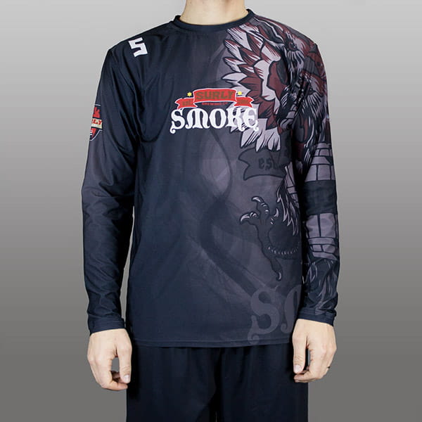 torso of man wearing a black long sleeved jersey with surly writing