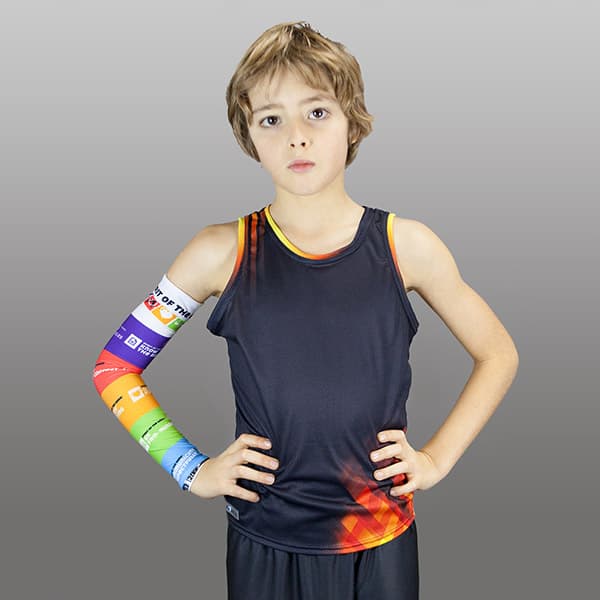 woman wearing a rainbow couloured compresion sleeve and a dark grey t-shirt