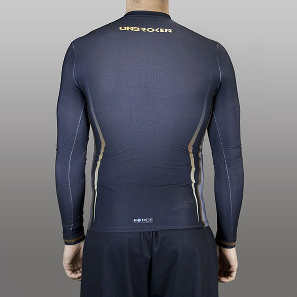 back of man wearing a black compression top with long sleeves