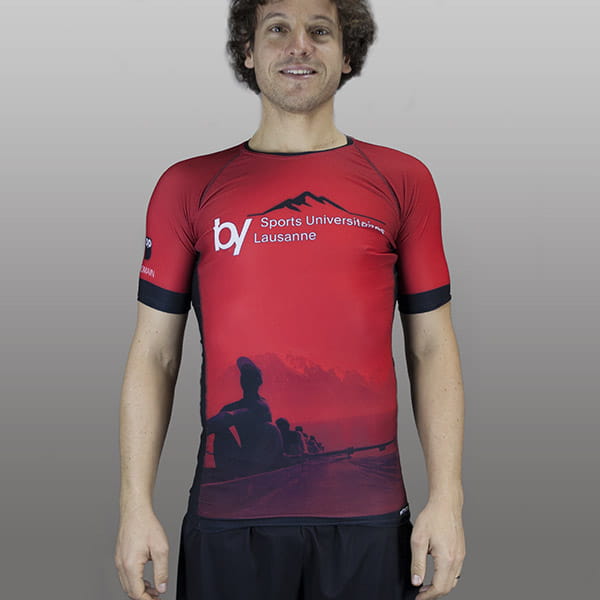 man smiling wearing a red compression top