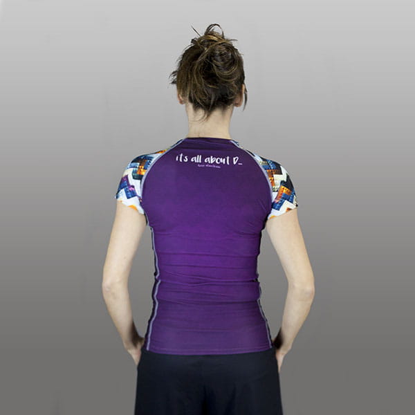 back of woman wearing a purple compression top