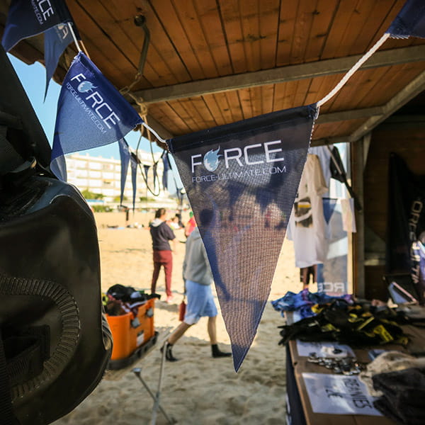 blue force garland with triangle flags on beach
