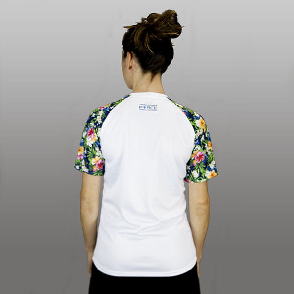 back of woman wearing a white and flowers sublimated raglan jersey