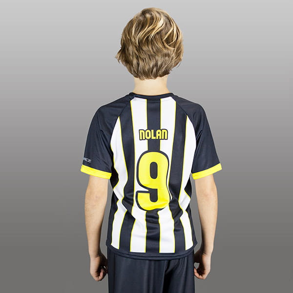 back of kid wearing a striped black and white raglan jersey #9