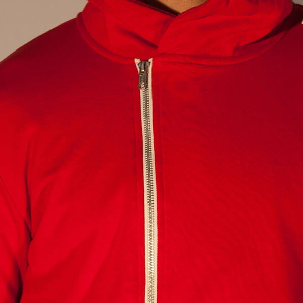 red hoodie with white metal zipper