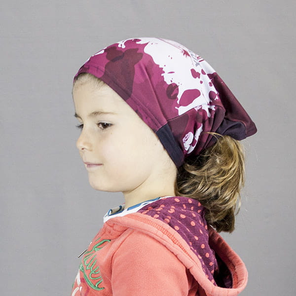 kid wearing a red and white bandana on her head