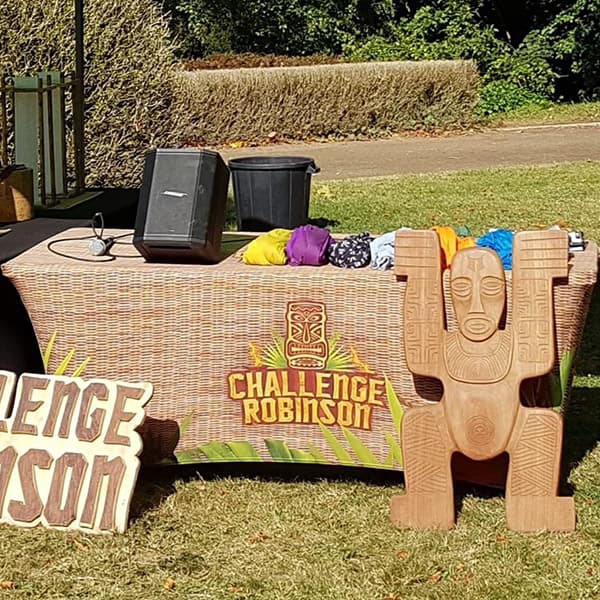 challenge robinson table cover and totem on grass field